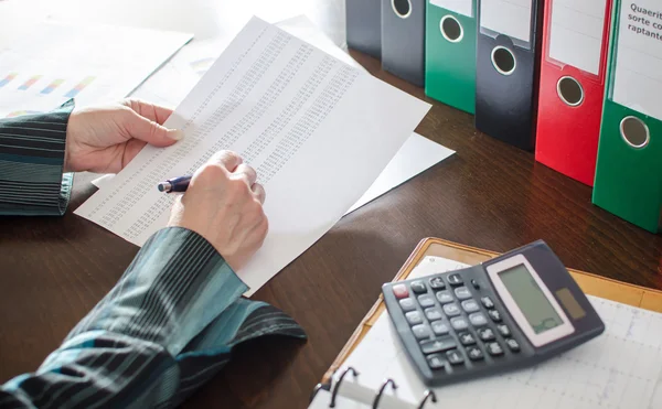 Female accountant checking financial documents — Stock Photo, Image