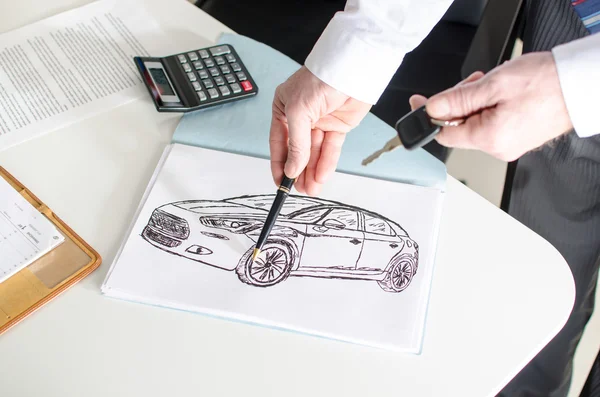 Car salesman showing a car design — Stock Photo, Image