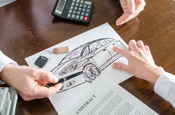 Dealer showing a detail on a car design — Stock Photo, Image