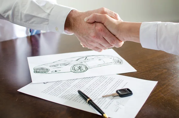 Dealer shaking hands with his customer — Stock Photo, Image