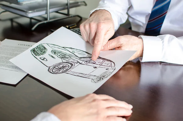 Dealer showing a detail on a car design — Stock Photo, Image