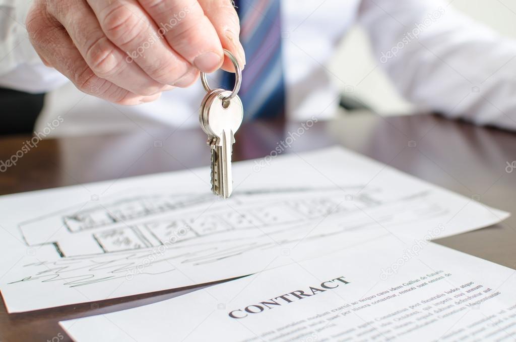 Estate agent holding house keys
