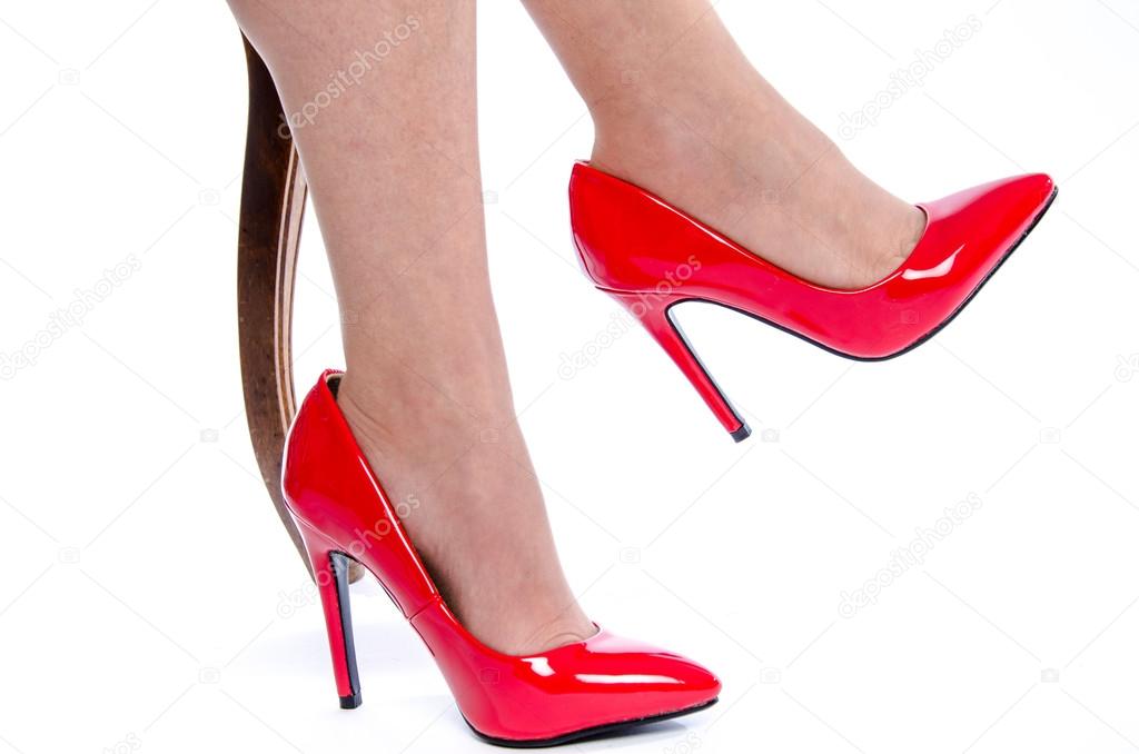 Woman wearing red high heel shoes