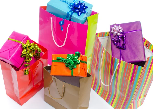 Gifts in paper shopping bags — Stock Photo, Image