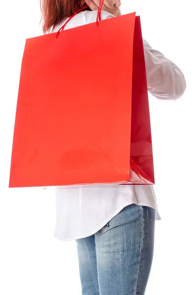 Woman holding a shopping bag on her shoulder — Stock Photo, Image