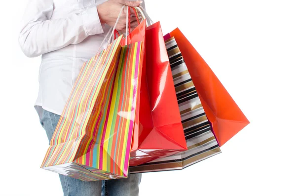 Mulher carregando sacos de compras — Fotografia de Stock