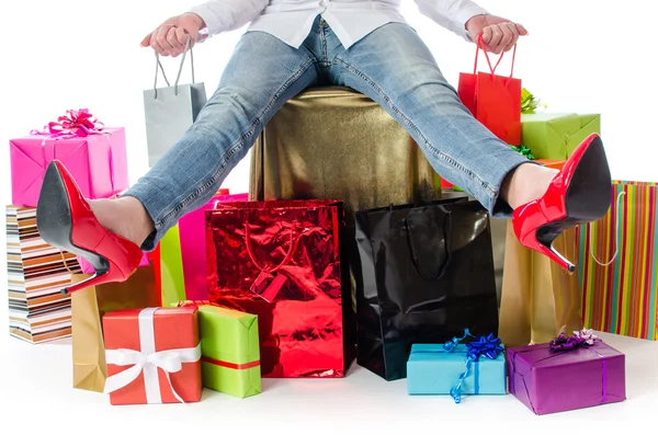 Happy woman with many bags around her — Stock Photo, Image