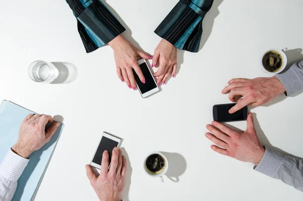 Business people using their smatphone — Stock Photo, Image
