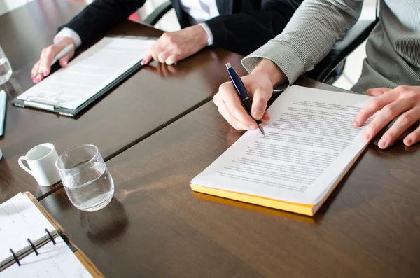 Business people taking notes — Stock Photo, Image