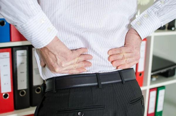 Businessman with back pain — Stock Photo, Image