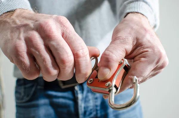 Man opening a padlock — Stock Photo, Image