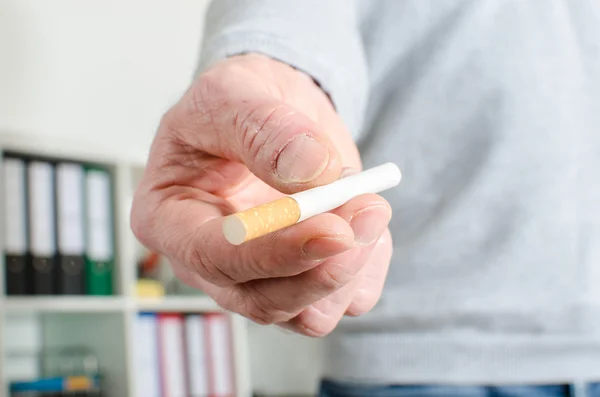 Man hand offering a cigarette — Stock Photo, Image