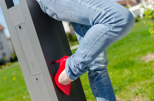 Fashioned woman wearing red high heel shoes — Stock Photo, Image