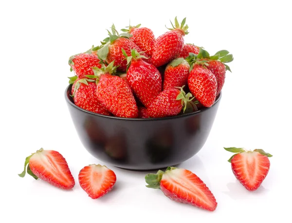 Fresh strawberries in a black cup — Stock Photo, Image