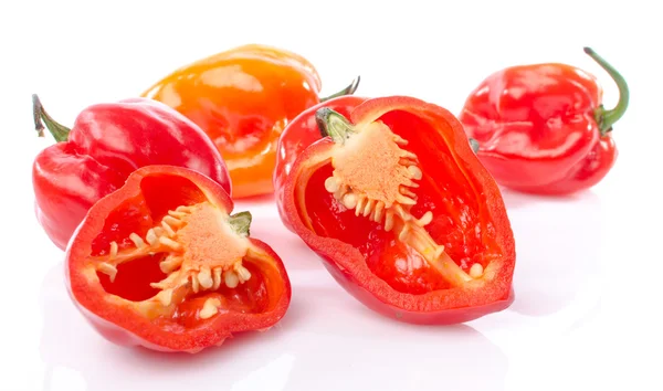 Fresh whole and half habanero peppers — Stock Photo, Image