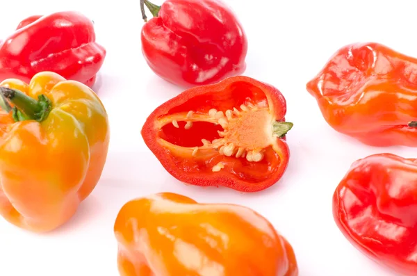 Fresh whole and half habanero peppers — Stock Photo, Image