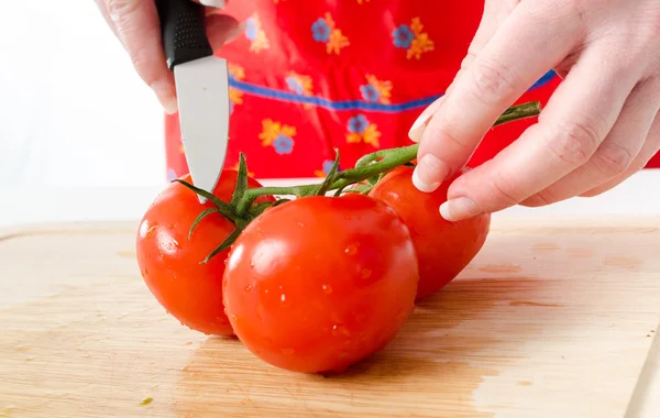 Fresh tomatoes on wooden board — Stock Photo, Image