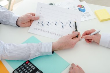 Business team working on stock charts