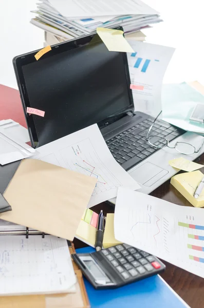 Untidy and cluttered desk — Stock Photo, Image