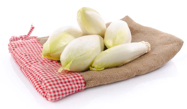 Fresh chicory on a burlap — Stock Photo, Image