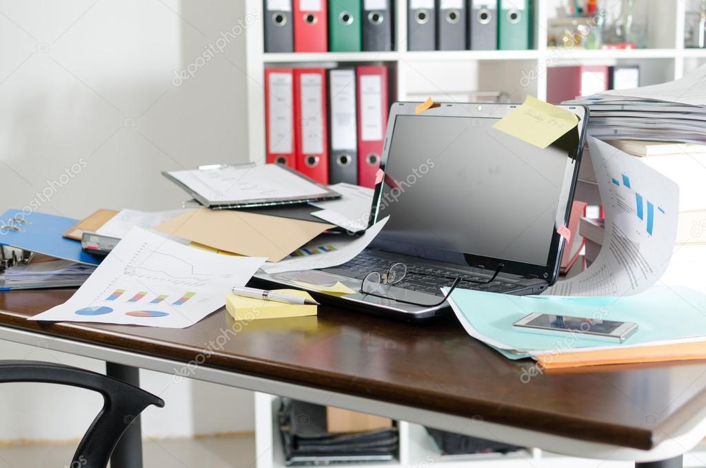 Untidy and cluttered desk