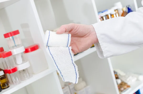 Doctor holding a roll bandage — Stock Photo, Image