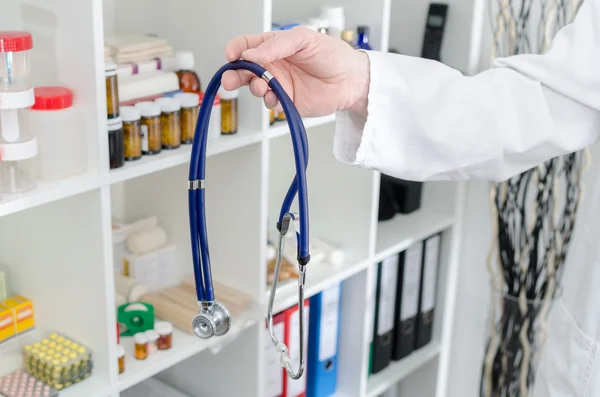 Doctor holding a stethoscope — Stock Photo, Image