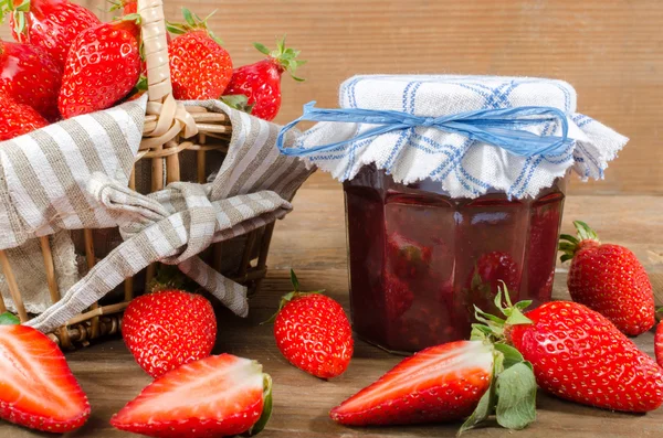 Jam jar with fresh strawberries