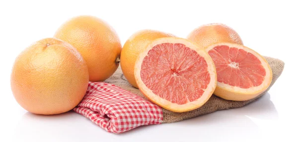 Čerstvé grapefruity na pytlovina — Stock fotografie