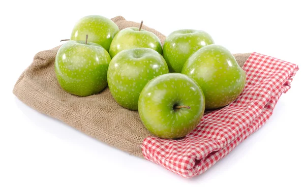 Manzanas verdes frescas en bolsa de arpillera —  Fotos de Stock