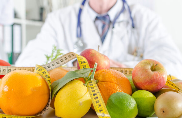 Doctor nutritionist with healthy fruits