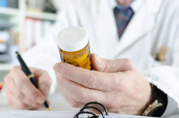 Doctor writing prescription — Stock Photo, Image