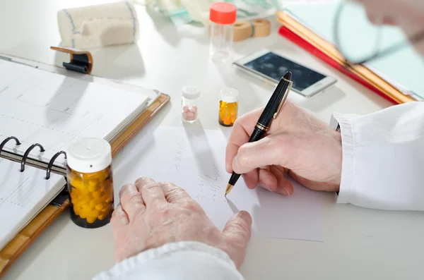 Doctor writing prescription — Stock Photo, Image