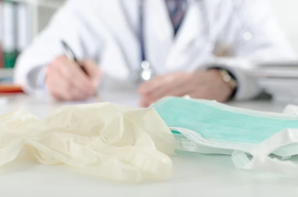 Gloves and surgical mask — Stock Photo, Image