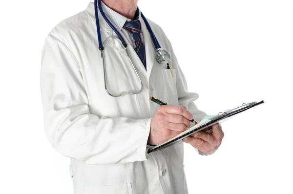 Doctor writing on a clipboard — Stock Photo, Image