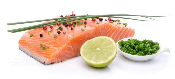 Fresh raw salmon fillet with herbs, lemon and spice — Stock Photo, Image