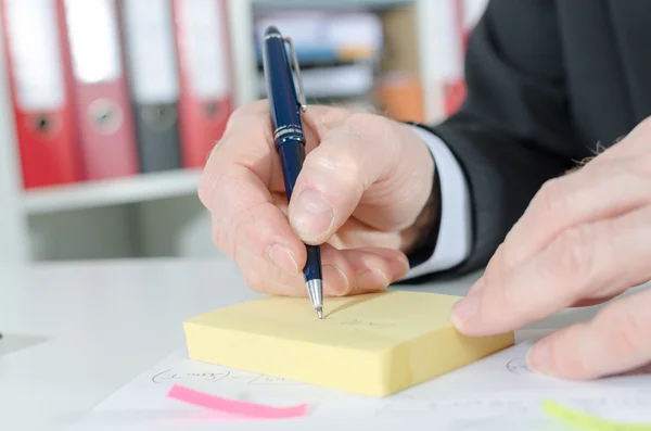 Businessman taking notes — Stock Photo, Image