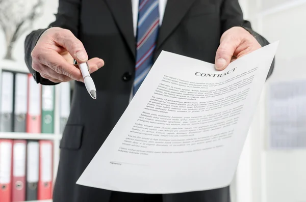 Businessman submitting a contract — Stock Photo, Image