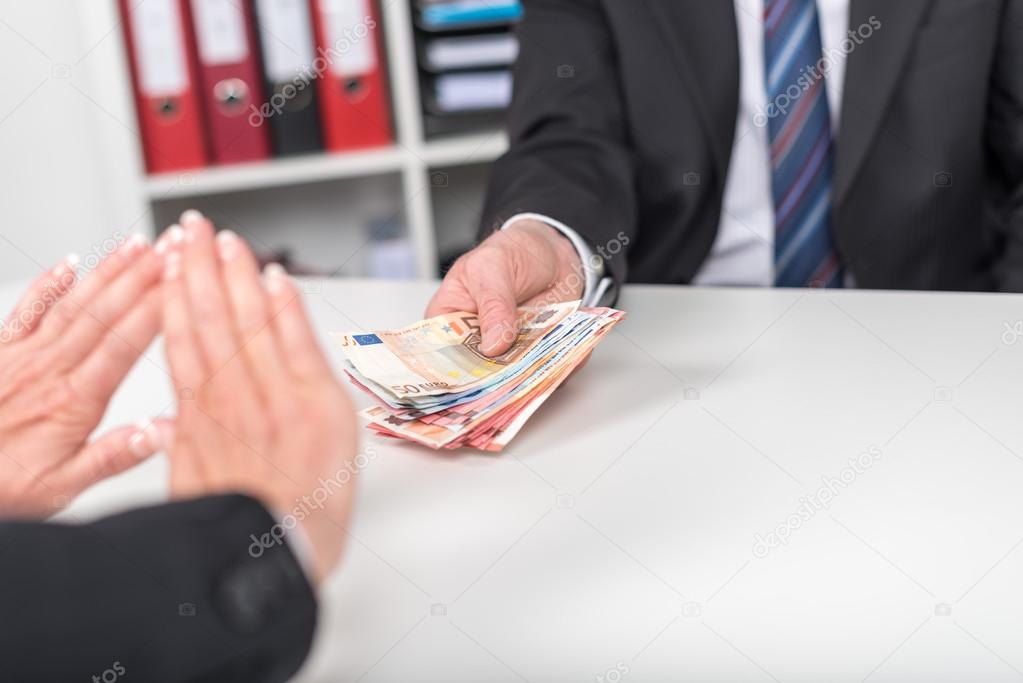 Woman hands rejecting an offer of money