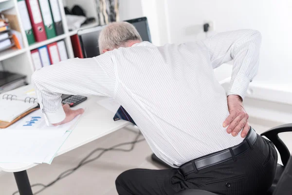 Businessman suffering from back pain — Stock Photo, Image