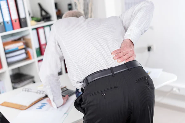 Businessman suffering from back pain — Stock Photo, Image