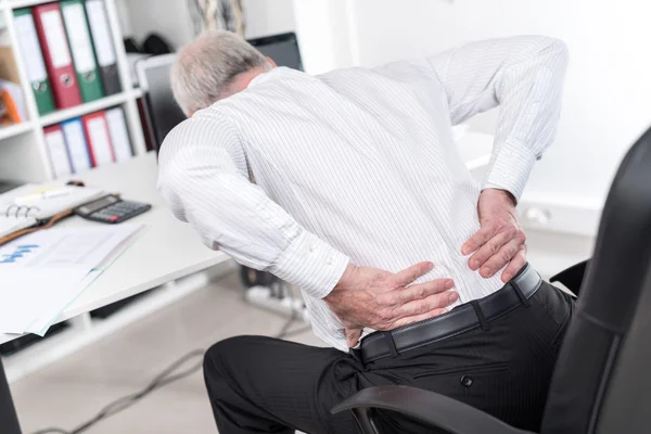Businessman suffering from back pain Royalty Free Stock Photos
