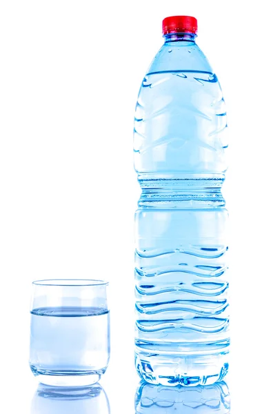 Plastic water bottle with a glass — Stock Photo, Image