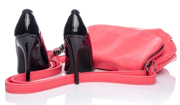 Pink handbag and black high heel shoes — Stock Photo, Image