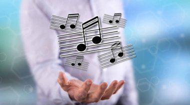 Müzik konsepti içinde geçmiş bir adamın elini yukarıda