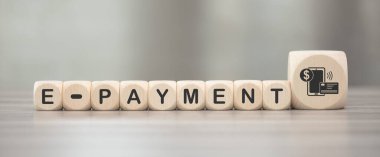 Wooden blocks with symbol of e-payment concept