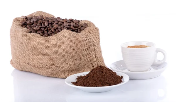 Cup of coffee with coffee beans and powder — Stock Photo, Image