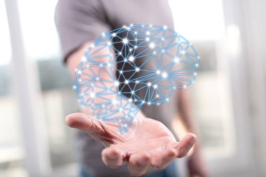 Yapay zeka kavramı arka plandaki bir adamın elinden üstündür.