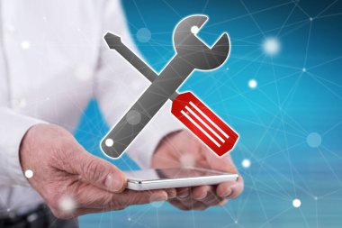 Bakım hizmeti kavramı, elle tutulan bir akıllı telefonun üzerinde