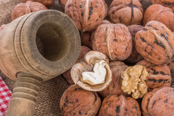 Fresh walnuts with nutcracker — Stock Photo, Image